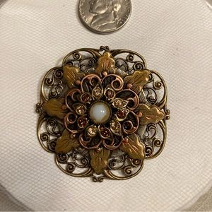 Antique brooch “flower of life” with pearl center and fire agate crystals